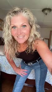 Blonde Girl with Angel Wings and Blue Jeans