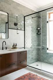 Many ancient civilizations, such as the romans and persians, took great pride in commissioning beautiful tile schemes and mosaics for their bathhouses and spas. This Unexpected Shade Of Green Is The New Neutral Here S How To Use It Bathroom Interior Design Green Tile Bathroom Modern Bathroom Tile