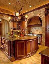 Many tuscan kitchen designs feature the trademark colors of the region, which reflect the rich soil, abundant sunshine and rolling green hills of tuscany. Light Color Tuscan Kitchen Design Tuscan Kitchen With Pendant Lights And Stone Arch The See More Ideas About Tuscan Tuscan Decorating Tuscan Style Katalog Busana Muslim