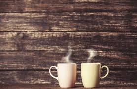A coffee table isn't just a place to put down your coffee or put up your feet. M Two Cups Of Coffee On Wooden Table 000044323704 Large The Frothy Cup