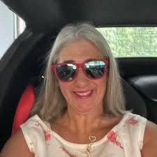 This antique ceramic figurine depicts a Siamese cat stretching out and  playing with a ball. Made in Japan in 1960, this piece is a great addition  to any cat lover's collection. The