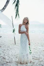 A halter top wedding dress features straps or fabric that turn inward, often tying, hooking or otherwise connecting behind the neck. 44 Stunning Halter Neckline Wedding Dresses Weddingomania
