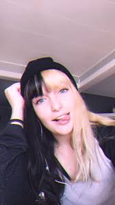 The rest of the hair is tied up in a low bun, creating a voluminous updo. Half And Half Hair Blonde Hair With Bangs Black To Blonde Hair Half And Half Hair