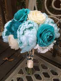 We scout the market for the best flowers available and designed a very large collection of bouquets for our. Tiffany Blue Silk Bridal Bouquet Silk Peonies Teal Ranunculus Turquoise Poppies White Roses Blue Wedding Bouquet Silk Wedding Bouquets Bridal Bouquet Peonies