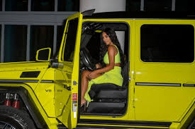 Kim Kardashian Revealing Neon Outfit Miami Beach Reality Tv Diva Wore A Fluorescent Yellow Ensemble In The Sam Kardashian Cars Mercedes G Wagon Mercedes Truck