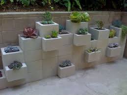 The easiest way to brighten a cinder block wall in your garden or yard is to paint it. 45 Beautiful Cinder Block Furnitures For Upgrade Space Garden Decoarchi Com Cinder Block Garden Wall Gardens Diy Cinder Block Garden Wall