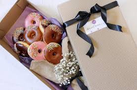 Ditching the typical floral bouquet, a bride decided to carry a bouquet of doughnuts as she walked the aisle along with her bridesmaids. The Donut Bride