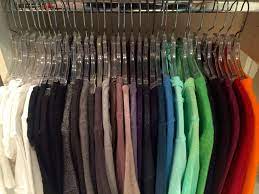 Remove everything from the closet, including hangers, baskets, bins, and anything else that might be on the floor or shelves. Q How Do I Organize Hanging Clothes By Color Hanging Clothes Color Coordinated Closet Hanging Clothes Organizer