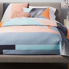 Climbing into a fort of sheets + covers to make your bed. 400 Thread Count Organic Sateen Brushed Collage Duvet Cover