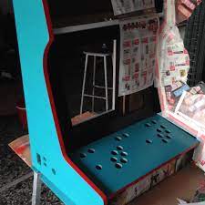I used some wood putty to fill in some holes and nasty parts, let them dry. Arcade Machine Hackermagnet
