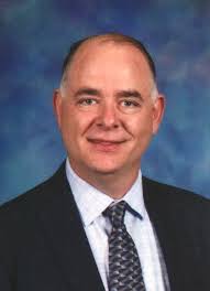 Srbo Radisavljevic, Norridge District 80 board president, was cited for  disorderly conduct.. On or about 2-19-2019 a suspicious package was  received by complainant containing a black t-shirt with complainant's  mugshot that stated “