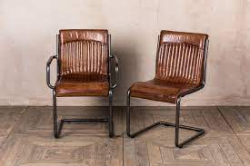 Fill an apartment family room with an arm chair and a loveseat. Leather Dining Room Chairs Peppermill Interiors