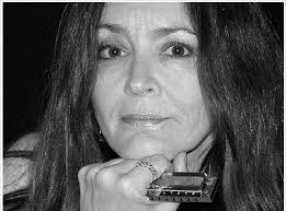 Harmonica player Tracy K plays the blues at 1500 Club