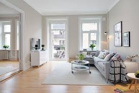 Bright Scandinavian Apartment With Cream Walls And Two Balconies Scandinavian Apartment Floor Design Living Room Hardwood Floors