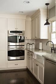 Off White Cape Cod Cabinets With Laminate Floor Google Search Off White Kitchen Cabinets Off White Kitchens Kitchen Renovation