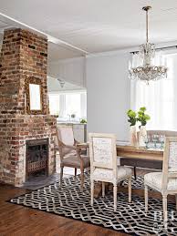 You Won T Believe The Impressive Renovation Of This 100 Year Old Home Dining Room Fireplace Exposed Brick Fireplaces Home Remodeling