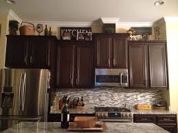 See more ideas about kitchen design, dark kitchen cabinets, dark cabinets. Pin By Lori Mann On Lori S Projects Kitchen Cabinets Decor Decorating Above Kitchen Cabinets Kitchen Decor