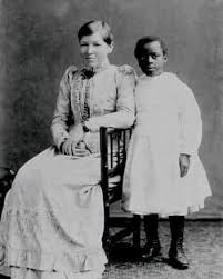 Mary Slessor and her adopted Nigerian daughter, Janie Annan Slessor,  formerly Atim Eso, visit Topsham, Devon, United Kingdom, 1891. Slessor  (December 2, 1848&ndash;January 13, 1915) was a Scottish missionary who worked  with
