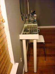 Acrylic trays from the local craft store fit perfectly between the shelf and glass to store all of my makeup. Makeup Vanity For Small Spaces Ikea Hackers