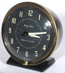 It has a metal case with white enamel paint and a white plastic pedestal stand. Baby Ben Style 7 Alarm Clock Made In October 1976 Clockinfo Com