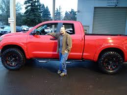 Today, the toyota tundra is a popular vehicle for sale on the used pickup truck market and continues to compete well in a highly competitive class. Red Toyota Tundra With Black Wheels Drool But Swap Out The Cheesy Running Boards For Black Ones Toyota Tundra Toyota Tundra