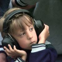 Technical Sergeant Lester Hamrick, Seymour Johnson's family readiness NCO,  ensures families like the Wells are cared for while STAFF Sergeant Trey  Wells is deployed. Hamrick hands young Joey Wells a prepaid calling