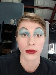 I then added my blue eyeshadow, my dark red lipstick, and drew