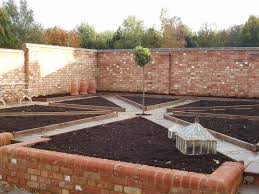 A Productive Walled Kitchen Garden Can You Imagine Walking The Paths With The Planters Full Of Herbs Or Fragrant Kitchen Garden Garden Wall Brick Wall Gardens