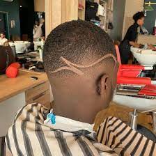 This is another take on that classic and classy buzz cut: Hair Cut Design For Black Man