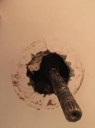 I see a lot of hard water deposits/corrosion on the inside of the spout around the spout threading. Stuck Bathtub Faucet Stem Home Improvement Stack Exchange