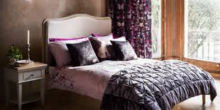 The moody bedroom is deeply relaxing, with deep purple walls, black bedroom furniture and hits of metallics that pick up the light. Romantic Bedroom Ideas Decorating Ideas Interiors