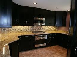 You can repaint your old kitchen cabinets become espresso colored. Espresso Kitchen Cabinets With Backsplash Youtube