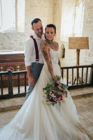 This modern wedding dress with tattoo effect style is defined by gorgeous backs where the tattoo look is a result of layering delicate lace and tulle to decorate your skin with most incredible patterns. Tattooed Brides Should You Show Off Your Tattoos On Your Wedding Day