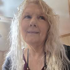 Uyles Dunford holding his son Dennis. The two little girls are Ernestine "  Tinky" and Marlene Dunford. The boy next to them is Orrie Addair. The lady  in back is Ola Sweeney