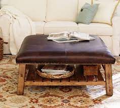 The largest ottoman can store the smaller inside it, and features a tray table on the reverse of its lid, turning it into a coffee table at the drop of a hat. Caden Square Leather Ottoman Pottery Barn