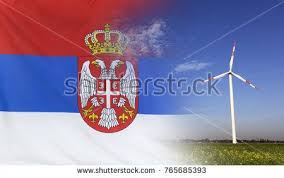 Concept Clean Energy With Flag Of Serbia Merged With Wind Turbine In A Blue Sunny Sky And Green Grass With Flowers Serbian Flag Stock Photos Image
