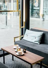 Behind sofa bar table insidestories org. Build Inc Architects Adds Brass Veins To Munich Bar Interior