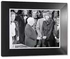 Framed Print of Charlie Chaplin Speaking with Johnny Mathes
