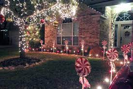 Covering The Miles Diy Candy Post Christmas Decorations Diy Outdoor Outdoor Christmas Decorations Christmas Lights Outside