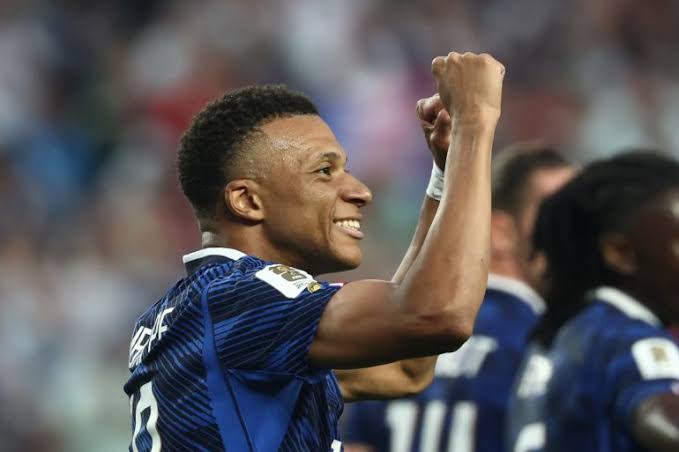 Milestone Brilliance: Kylian Mbappé celebrates one of his two crucial goals on his 100th international appearance., AI generated