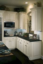 May also interest you kitchen sink faucets. 40 Cozy White Kitchen With Dark Floors Jenny Decor Distressed Kitchen Cabinets Antique White Kitchen Dark Kitchen Floors