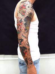 The filler tattoo must be in sync with your original tattoo and at the same time compliment it. Traditional Tattoo Sleeve Filler Ideas For Men