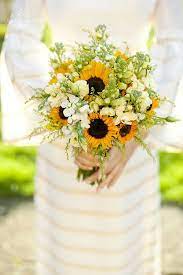Wedding flowers are one of the most stand out elements to your special day, providing elegance, fragrance or even a fun pop of color. Sunflower Wedding Flower Ideas In Season Now Sunflower Wedding Bouquet Rustic Sunflower Wedding Sunflower Themed Wedding