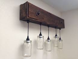 The led lights are recessed into the wooden beam that acts as a track to hold the lights together. Diy Rustic Bathroom Vanity Lights Novocom Top