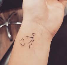 A circle, a straight line, a dot, etc. Small Dog Wrist Tattoo Tiny Tattoo Inc