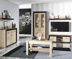 Modernost projektu zdůrazňuje výjimečná stylistika bílého lesku předních částí ve spojení s dekorem v modní barvě antracit. Oliwier 23 Sonoma Jasna Sonoma Ciemna Polka Ml Meble