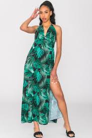 Cette robe longue noire loli signée albus lumen conjugue détails romantiques classiques et esthétique contemporaine épurée. Robe Longue Noire Motif Tropical Dos Nu Cinelle Paris Mode Femme Tendance
