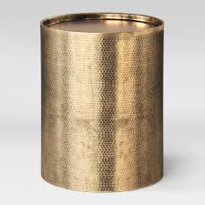 This is an ornate wooden coffee table detailed with hammered brass and tacks. Brass Hammered Drum End Table Riverhood Rentals