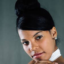 Messy bun hairstyle with braids and wrap. 27 Tantalizing Black Updo Hairstyles