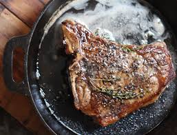 Watch how to make this recipe. Iron Skillet Steak With Thyme Butter